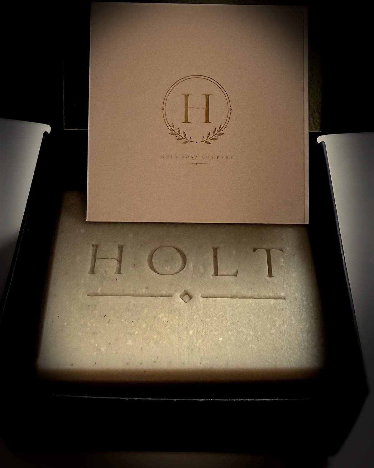 Holt soap bar and monogram card inside a black presentation box